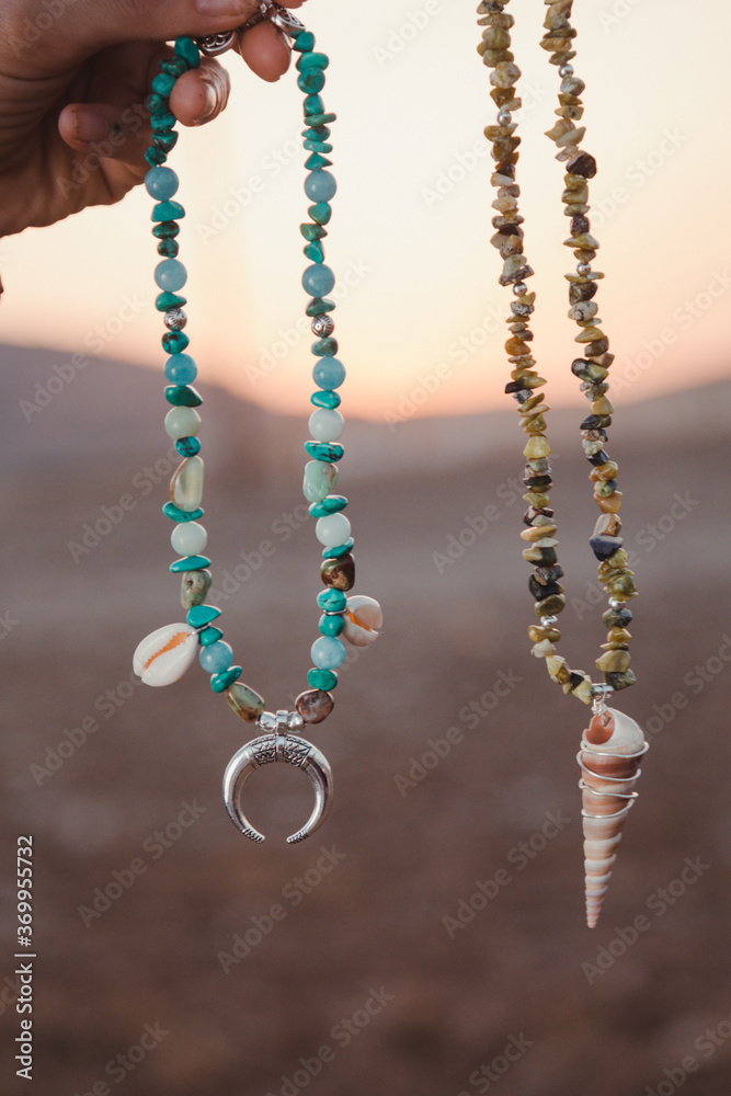 a Necklace in a desert place background in the sunset time of a day of summer in the south of Europe
a Necklace in a desert place background in the sunset time of a day of summer in the south of Europe