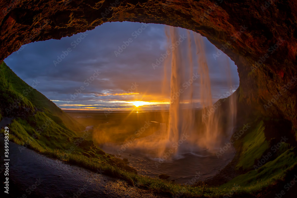 the majestic Seljalandsfoss Falls against the sunset. Iceland