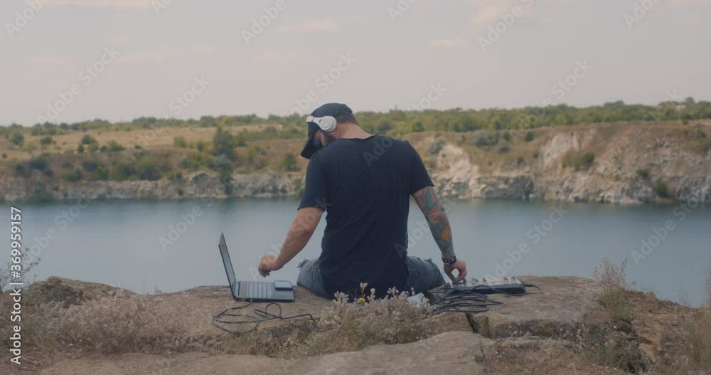 Musician enjoys music on a meadow Musician enjoys music on a meadow