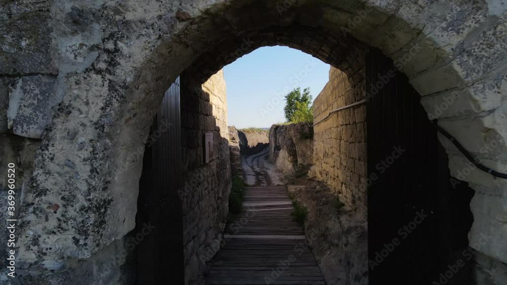 Dolly shot to a open fortress gate on top of mountain hill , visit us concept Dolly shot to a open fortress gate on top of mountain hill , visit us concept