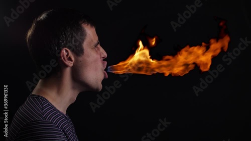 Jet of fire from the mouth of a man