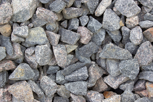 Abstract background with gray dry stones. Crushed stone.