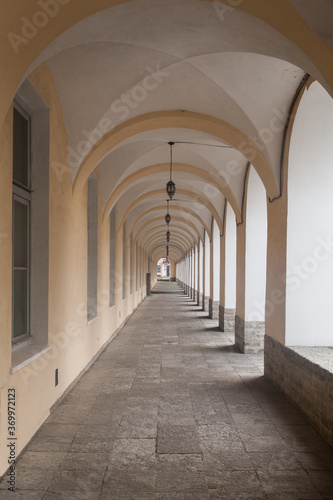 Empty vintage gallery   corridor with arches.