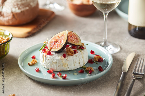 Mouthwatering cheese with figs and walnuts. photo