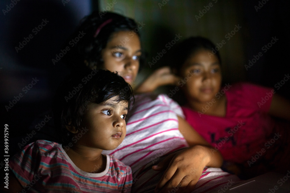 Teenage Girls and cute baby enjoying video in Laptop Teenage Girls and cute baby enjoying video in Laptop