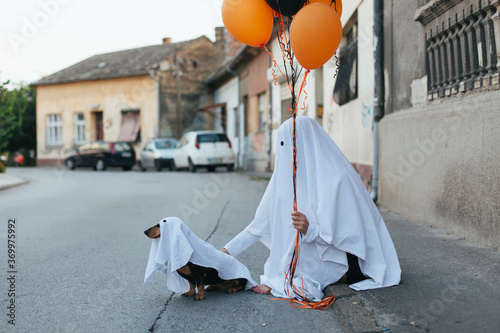 Ghost and his ghost dog on the street photo