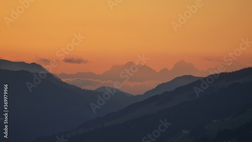 beautiful sunset on the mountains with orange sky and view to the alps © Chamois huntress