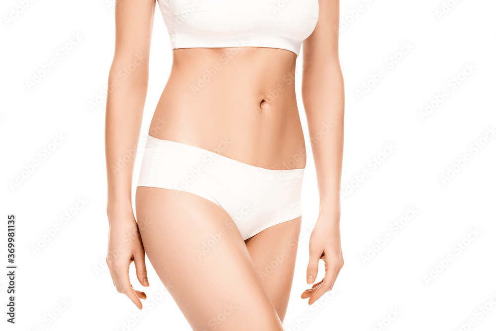 cropped view of woman with perfect body in panties and top standing isolated on white