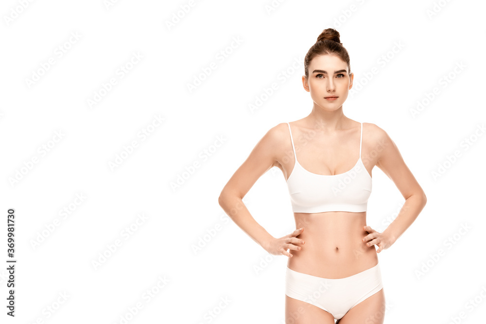 woman in panties and top standing with hands on hips and looking at camera isolated on white woman in panties and top standing with hands on hips and looking at camera isolated on white