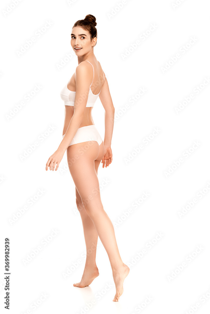 barefoot woman with perfect body looking away and walking on white barefoot woman with perfect body looking away and walking on white