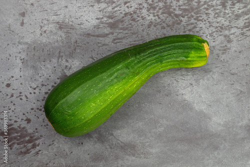Green summer squash on a gray tabletop