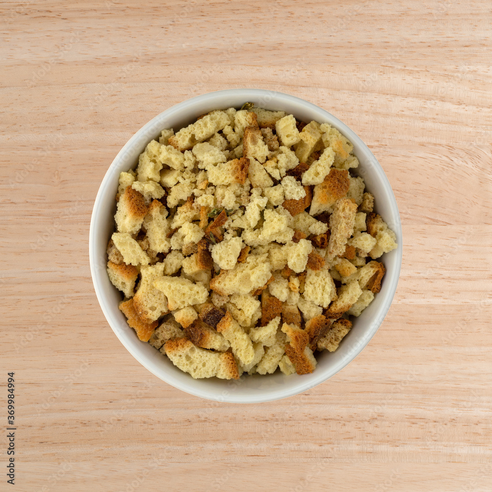 Bowl of stovetop stuffing on a wood table