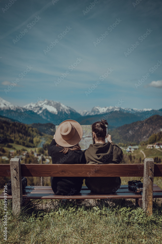 Couple sitting on a bench in Bavarian Alps