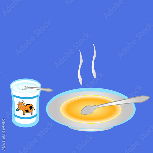 A plate of hot soup and a can of sour cream.