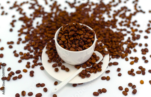 white coffee Cup and coffee beans on a white background  the concept of cheerfulness