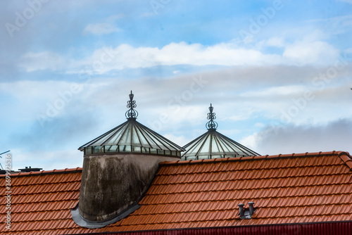 old house with tiled roof and transom at sunset in Porto