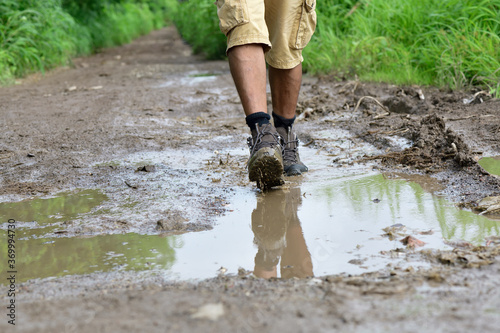 Walking with boots through a puddle