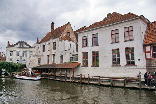 Historic buildings viewed from the Dijver Canal in the medieval city of Bruges, Belgium