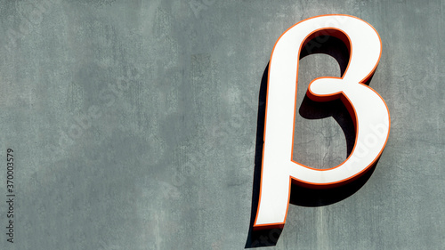 large letter beta on a grey background