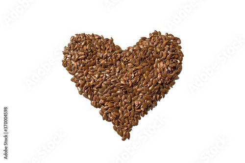 Flax seeds in the shape of a heart. Natural food. Fish Oil Replacement