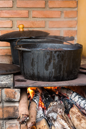 Pots and pans on the stove over a natural fire for cooking