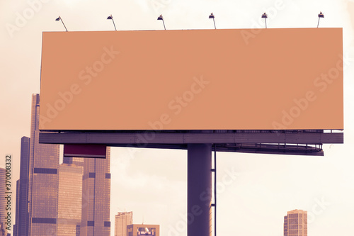large blank billboard against skyscrapers background