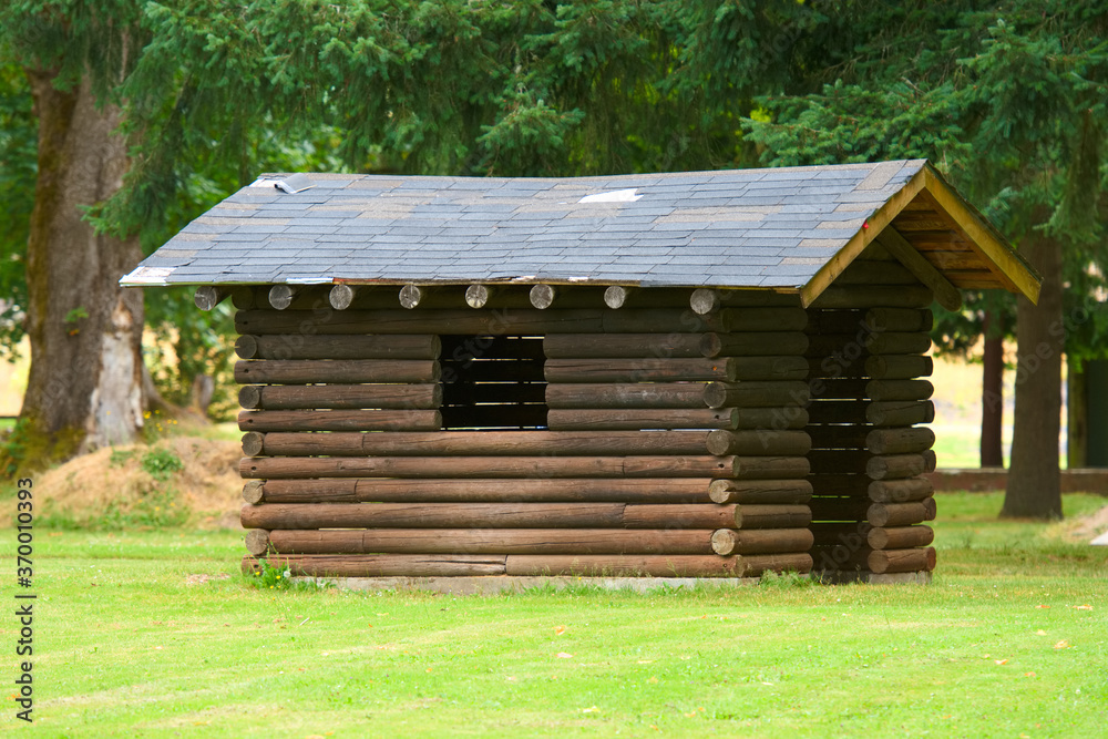 A log building in a park 