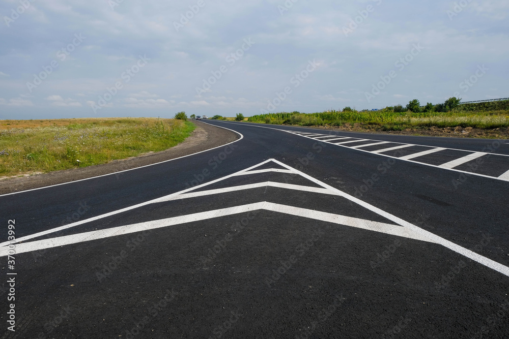 New road. Road markings. Fresh paint. Copy space. New road. Road markings. Fresh paint. Copy space.