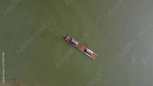 aerial view of traditional sand miners on the river