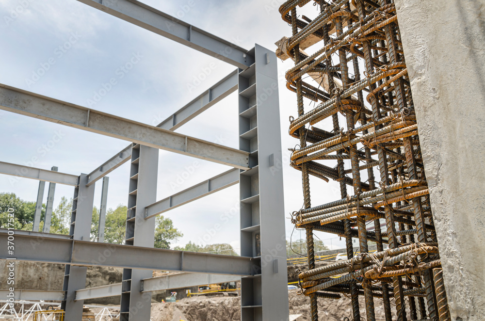 Construction site using metal girders and rebar
Heavy iron beams and reinforced rods used to construct building structures
