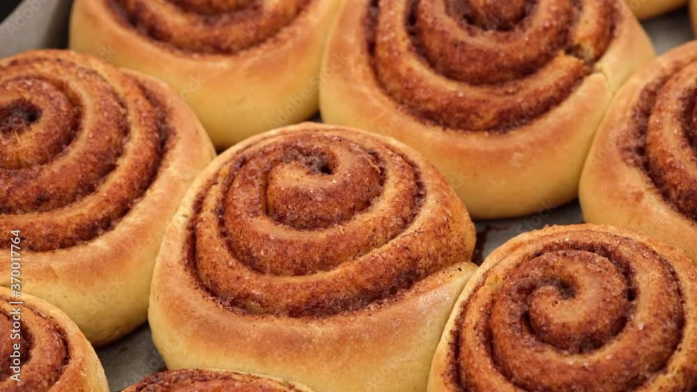 Freshly baked cinnamon rolls or Cinnabon close up rotating Freshly baked cinnamon rolls or Cinnabon close up rotating