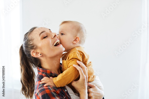 Fotomurale mother child baby having fun family happy childhood care cheerful cute boy sun