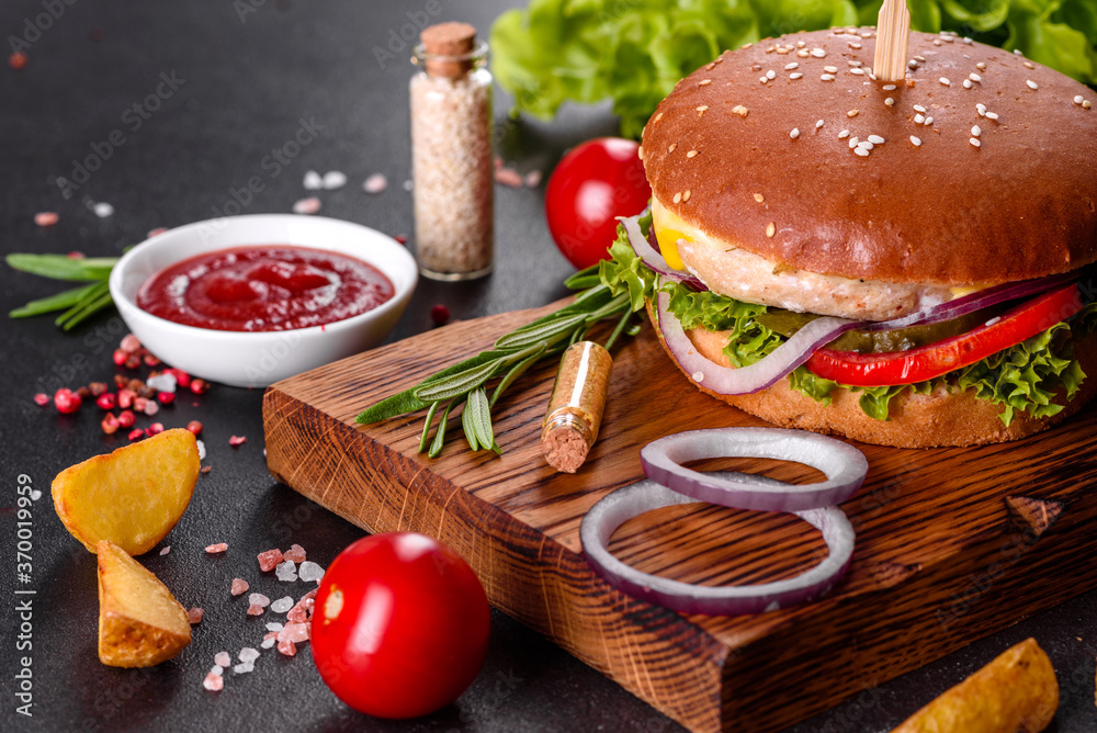 Delicious fresh homemade burger on a wooden table Delicious fresh homemade burger on a wooden table