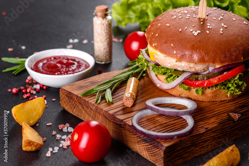 Delicious fresh homemade burger on a wooden table