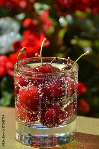 Glass of cherries and sparkling water