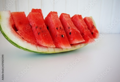 Juicy and ripe watermelon is cut into pieces.