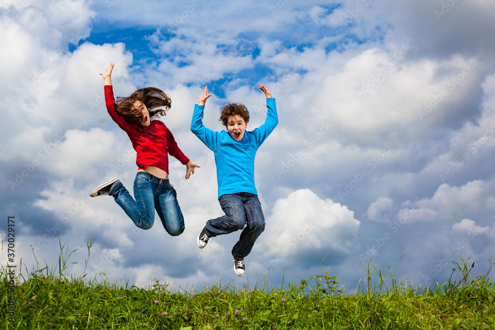 Girl and boy running, jumping outdoor Girl and boy running, jumping outdoor