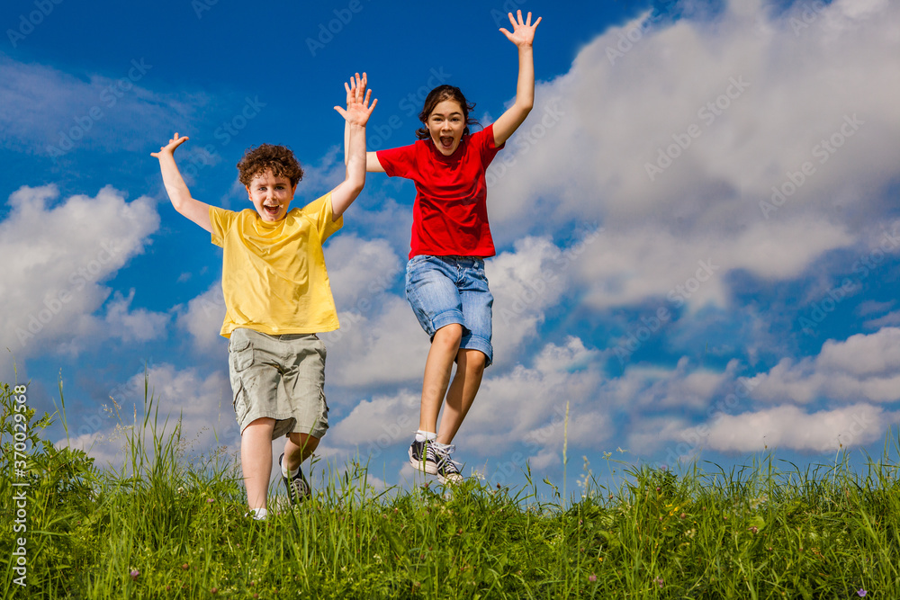 Girl and boy running, jumping outdoor Girl and boy running, jumping outdoor