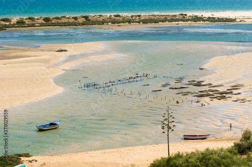 Fototapeta Naklejka Na Ścianę i Meble -  low tide at Cacela Velha beach in the Ria Formosa Natural Park, Algarve, Portugal