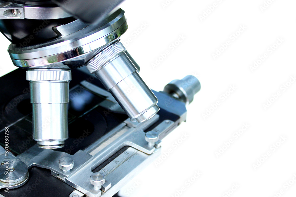 Black microscope on a white background, horizontal view. Medicine, science, research concept. Black microscope on a white background, horizontal view. Medicine, science, research concept.