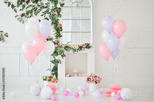Birthday party decoration with balloons and cakes