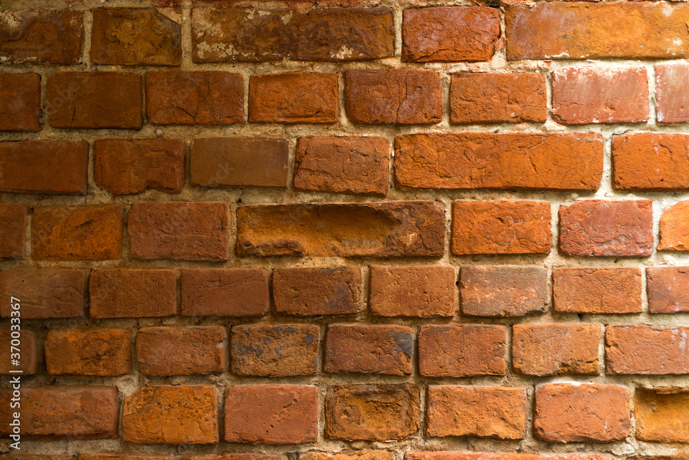 brick red wall texture. background of a old brick house. brick red wall texture. background of a old brick house.