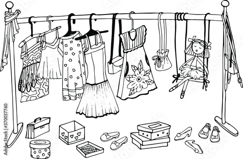  a coloring book with a dressing room, lots of dresses and shoes, a doll, boxes, and a hanger