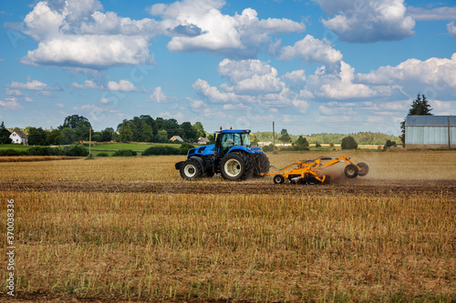 A tractor tillage of an agricultural field after harvesting