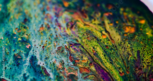 Macro paint creative unique image. Oil mixed dye, paint, macro images, in motion. Print, digital artwork, wallpaper, backgrounds, banners, cards, websites. Yellow, purple, raining down, vibrant © Kiwitography