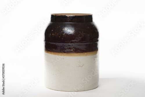 Antique apple butter crock isolated on a white background