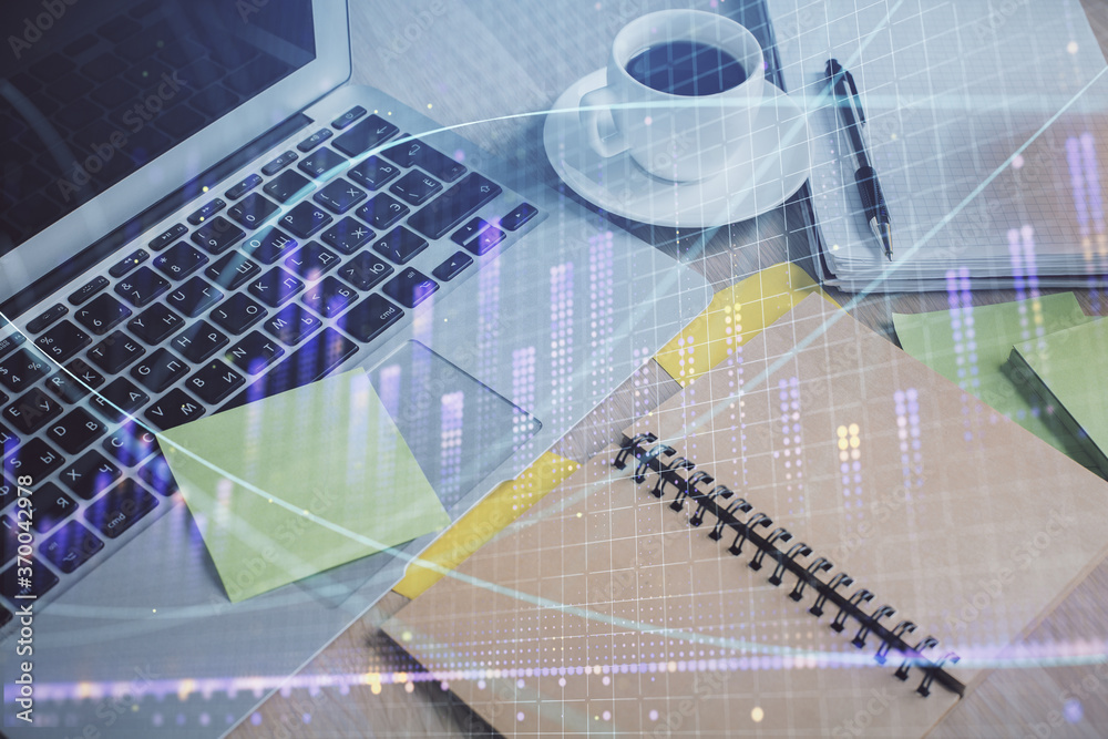 Multi exposure of forex graph drawing and desktop with coffee and items on table background. Concept of financial market trading Multi exposure of forex graph drawing and desktop with coffee and items on table background. Concept of financial market trading