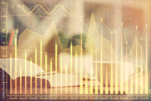 Multi exposure of forex graph drawing and desktop with coffee and items on table background. Concept of financial market trading © peshkova