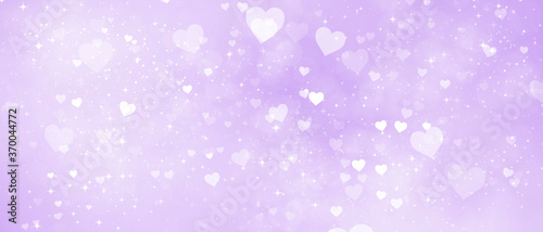 romantic shiny bright purple background with hearts and bokeh effect