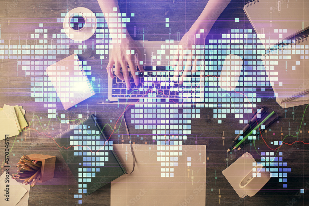 Double exposure of woman hands working on computer and financial theme hologram drawing. Top View. Business concept. Double exposure of woman hands working on computer and financial theme hologram drawing. Top View. Business concept.